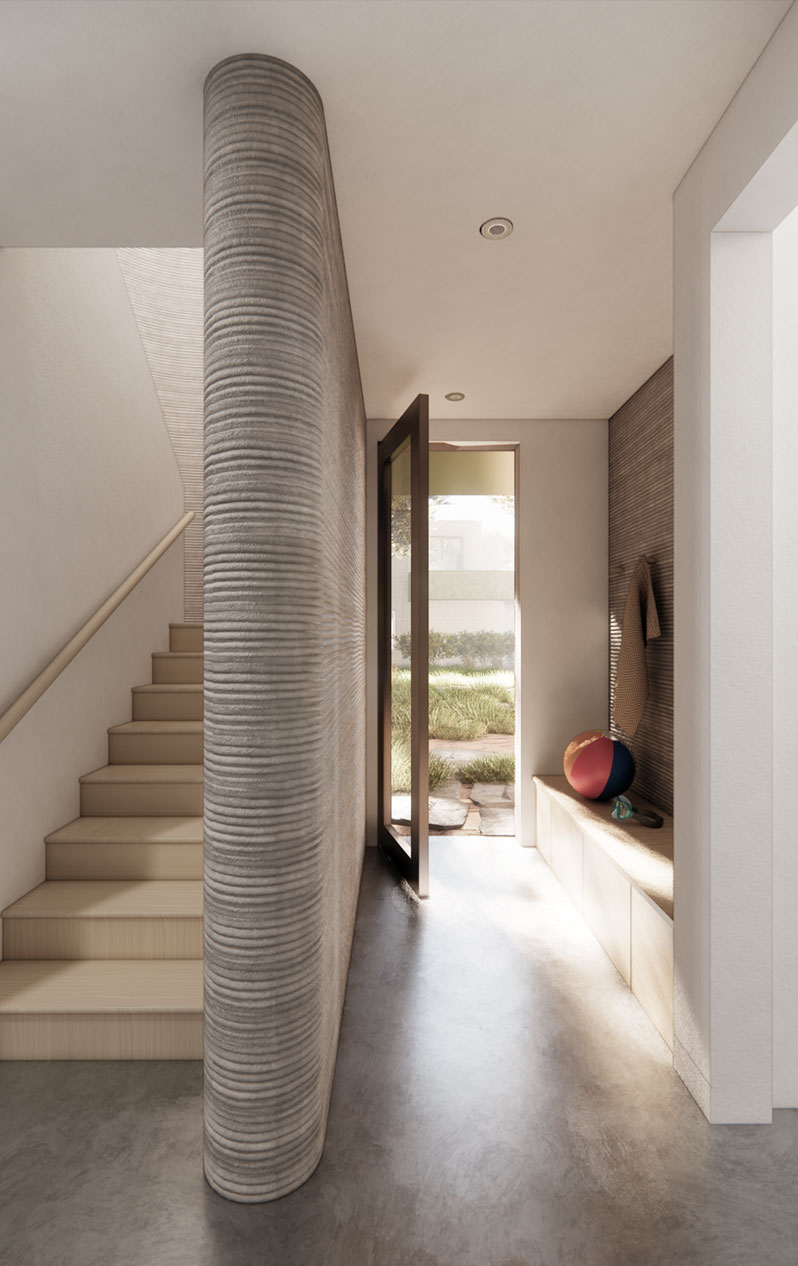 The ribbed, 3D-printed interior of an ICON home, a curved stair rising past a full-height doorway