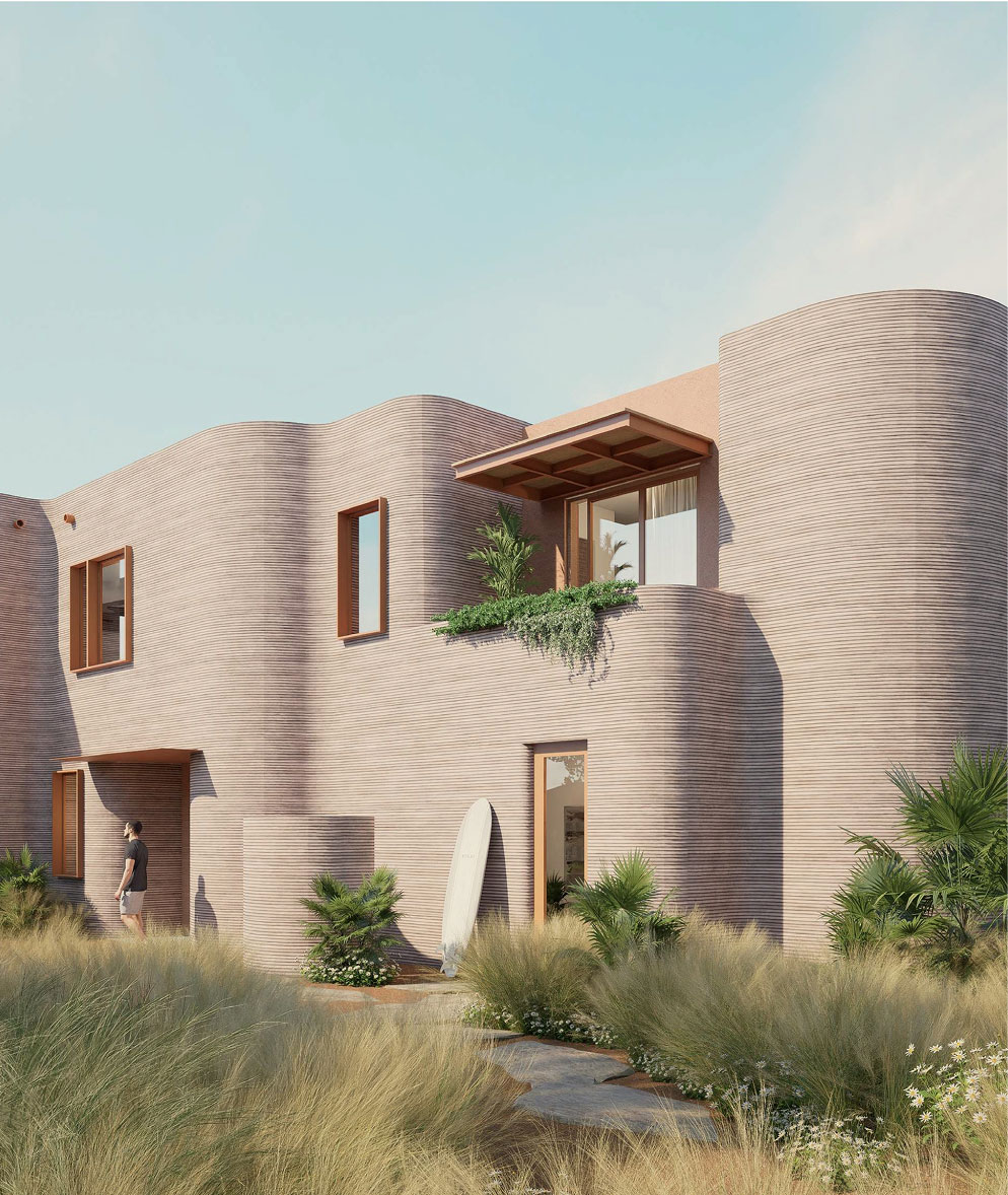 A cluster of two-storey ICON townhomes in printed stone, planted with native grasses